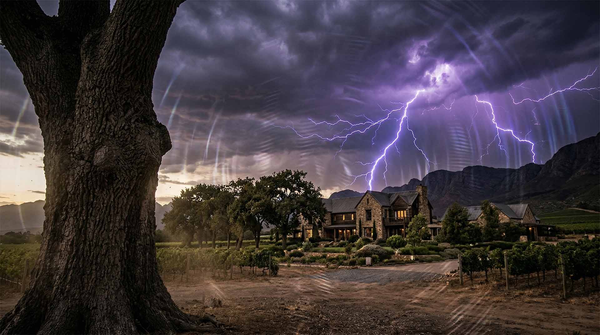 The Shimmering Premonition – Myrine Goes Through the Quantum Door A cinematic wide shot of a large stone manor house at dusk. A massive, gnarled oak tree dominates the foreground. In the dark, stormy sky above, purple lightning strikes, surrounded by translucent, circular ripples of energy that distort the clouds. Myrine Goes Through the Quantum Door